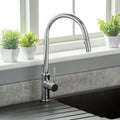 chrome kitchen tap with a black sink