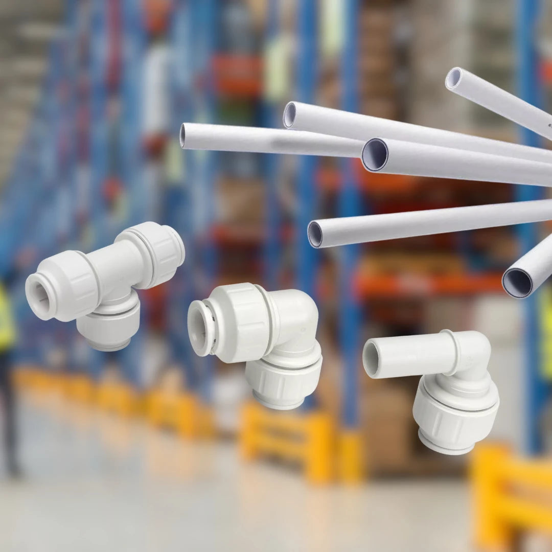 John-Guest-Speedfit fittings and pipes with a blurred background of a warehouse