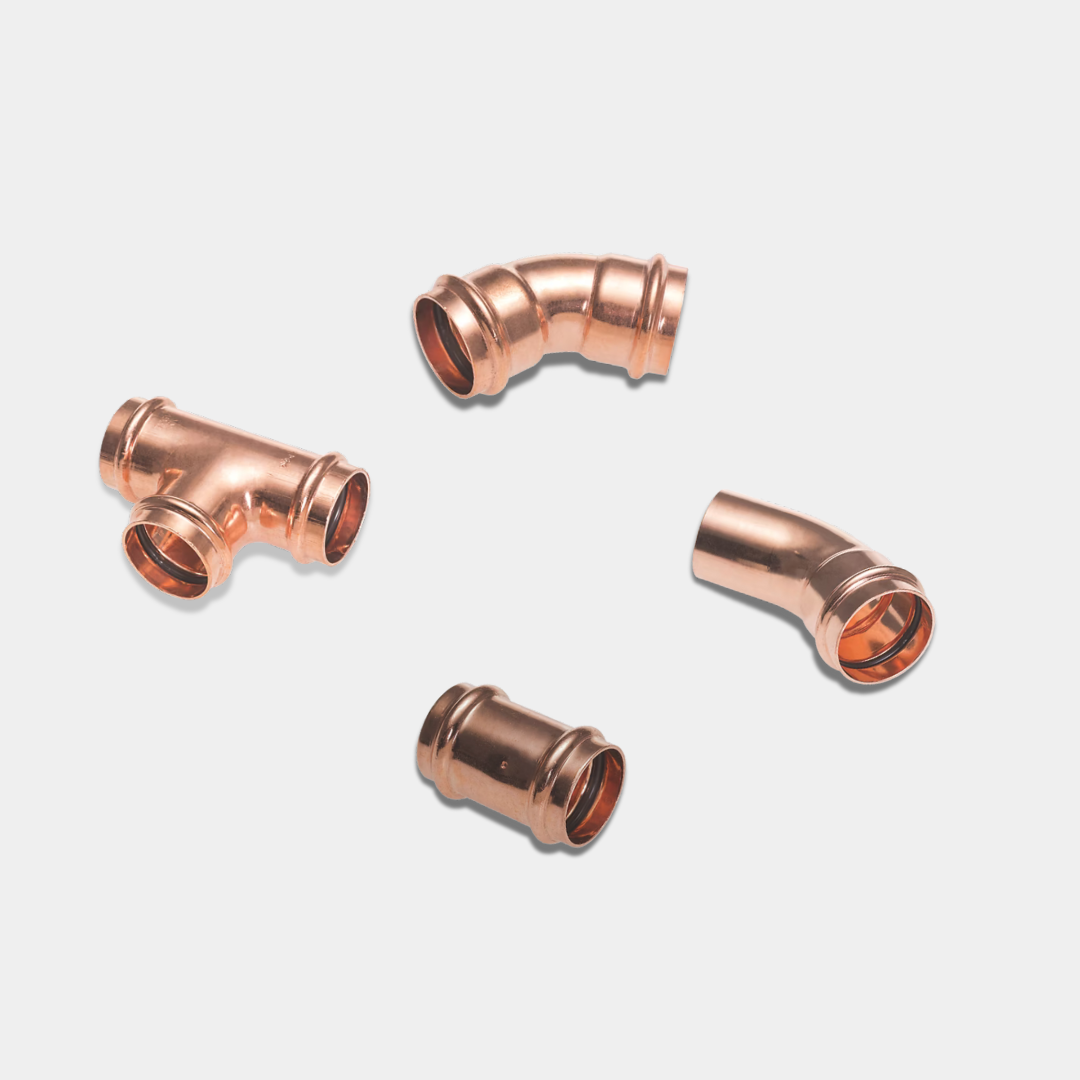 4 Press-Fit Plumbing Fittings On A Light Grey Background