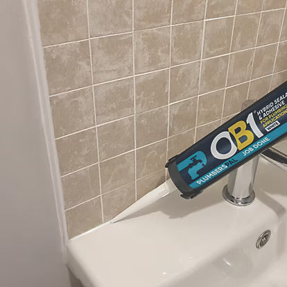 Ob1 being used to seal around the edge of white basin 